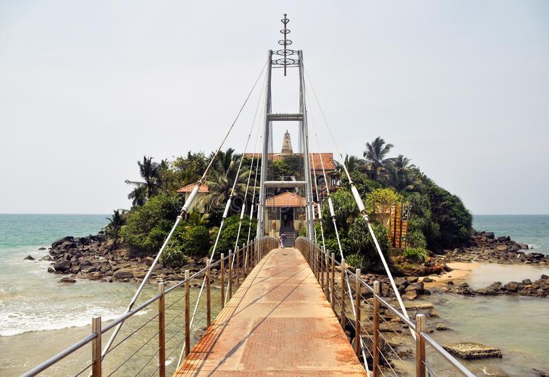 matara-sri-lanka-march-paravi-duwa-temple-оver-ocean-bridge-to-island-153087572