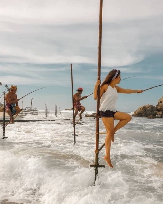 stilt fishing by a girl in koggala stilt fishing by a girl in koggala